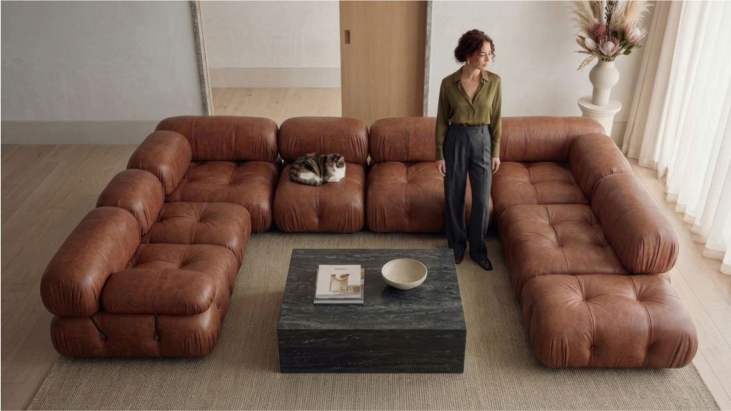 Living room styled with a top-grain leather Mario Bellini sofa with a girl and a cat