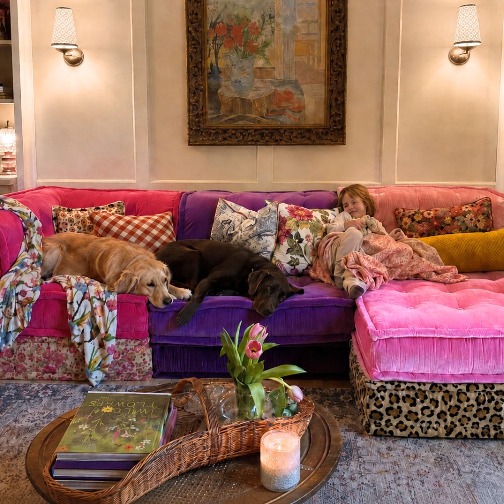 Child and two dogs relaxing on a colorful Mah Jong sectional sofa