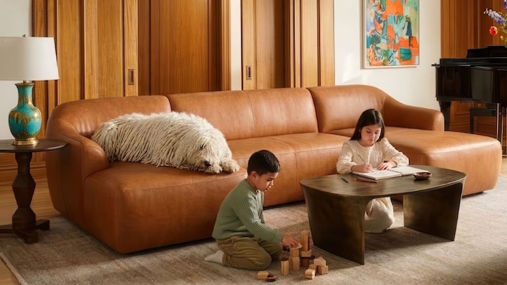 Two kids and a dog with a performance leather sofa