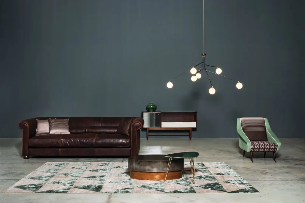 Baxter rounded leather corner sectional in tan/caramel in a stone-walled living room