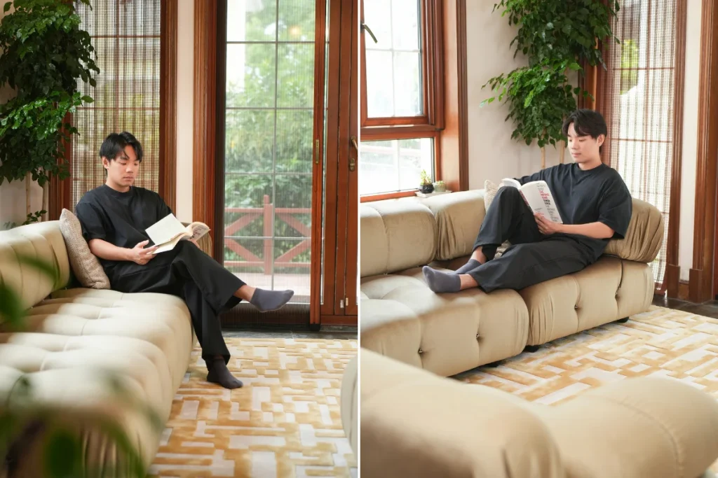 Two styles of sitting on a sofa, featuring both legs up and crossed legs